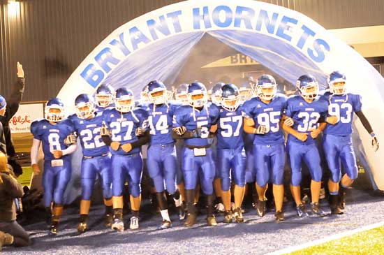 Bryant seniors take the field arm in arm Thursday night. (Photo by Kevin Nagle)