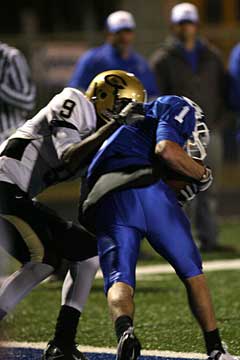 Bryant's Sawyer Nichols (1) cradles the football after catching a touchdown pass in front of Central's A.J. Tucker (9). (Photo by Rick Nation)