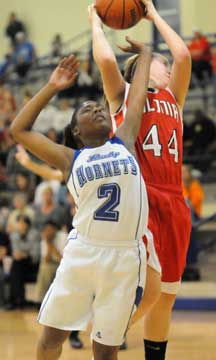 Vilonia's Jessica Brandon (44) goes up over Bryant's Jayla Anderson (2) for a rebound. (Photo by Kevin Nagle)