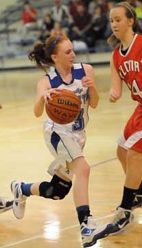 Bryant's Nikki Clay tries to drive around Vilonia's Cacy Simpson. (Photo by Kevin Nagle)