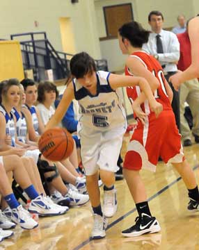 Bryant's Destiny Huffman (5) is forced out of bounds by Vilonia's Carly Whitehead. (Photo by Kevin Nagle)