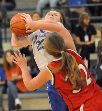 Bryant White's Skylar Davis (23) tries to get a shot away in traffic. (Photo by Kevin Nagle)