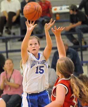 Lara White (15) launches a jumper during Monday night's game. (Photo by Kevin Nagle)