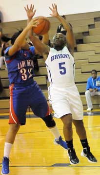 Bryant's Dezerea Duckworth (5) battles with Jasmine Patterson for a loose ball. (Photo by Kevin Nagle)