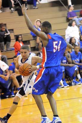 Bryant's Jordan Griffin tries to drive around West Memphis' Andrew Ricks. (Photo by Kevin Nagle)