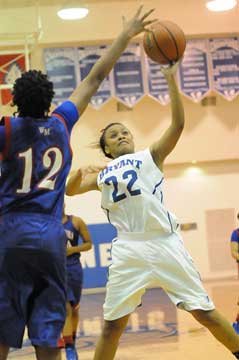 Bryant's Kiara Moore slashes past West Memphis defender Tenequa Robinson. (Photo by Kevin Nagle)