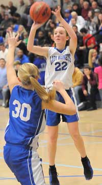 Bryant Blue's Britney Sahlmann (22) fires a shot over Bryant White's Julianna Ward (30). (Photo by Kevin Nagle)