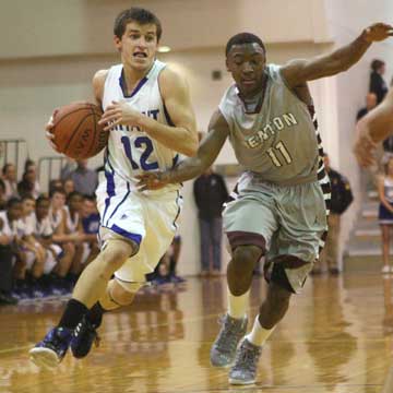 Bryant's Brantley Cozart (12) starts to drive past Benton's Ricky Gipson. (Photo by Rick Nation)