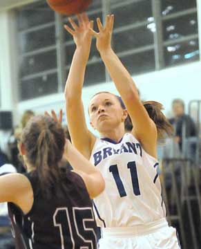 Logan Davis takes a jumper over Benton's Brooke Million. (Photo by Kevin Nagle)