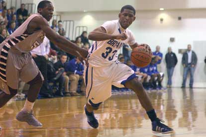 Bryant's Leon Neale (33) gets by Benton's Quinton Allen. (Photo by Rick Nation)