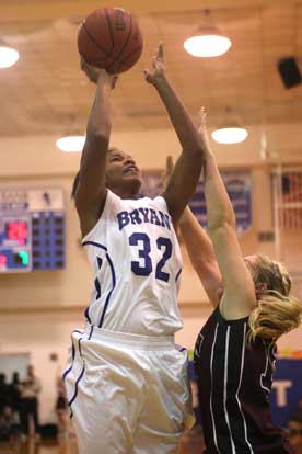 Bryant's Taneasha Rhode (32) shoots over Benton's Korie Parker. (Photo by Rick Nation)