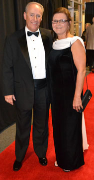 Dean and Barbara Riggin of Iberia Bank stop for a photo on the red carpet at the Starlight Gala at Bishop Park. (PHOTO BY Shontel Stott)