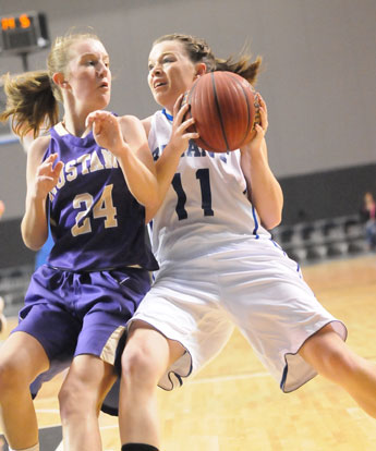 Bryant's Logan Davis (11) is cut off by CAC's Sarah Butler. (Photo by Kevin Nagle)
