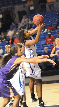 Taneasha Rhode grabs a rebound. (Photo by Kevin Nagle)