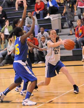 Britney Sahlmann (22) controls the ball for Bryant. (Photo by Kevin Nagle)