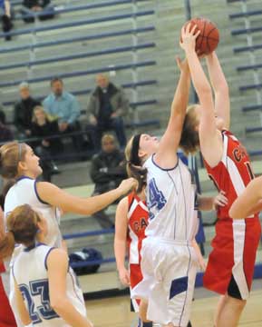 Bryant's Jamie Jamison (44) competes for a rebound. (Photo by Kevin Nagle)