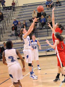 Bryant's Taylor Lindberg (21) takes a jumper in front of teammates Jayla Anderson (2) and Mallory Curry (30). (photo by Kevin Nagle)