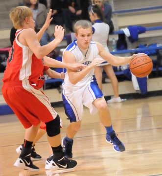 Bryant's John Winn works around a double-team. (Photo by Kevin Nagle)