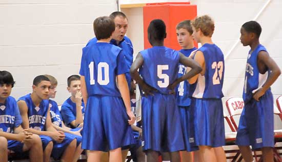 Bryant Blue coach Derek McGrew instructs his players during a timeout Tuesday night. (Photo by Kevin Nagle)