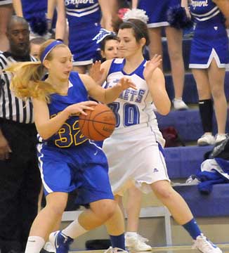 Bryant's Mallory Curry (30) applies some defensive pressure. (Photo by Kevin Nagle)