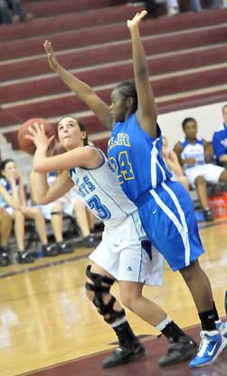 Bryant's Aubree Allen looks for room to shoot over or around North Little Rock's Rakeithia Collins. (Photo by Kevin Nagle)