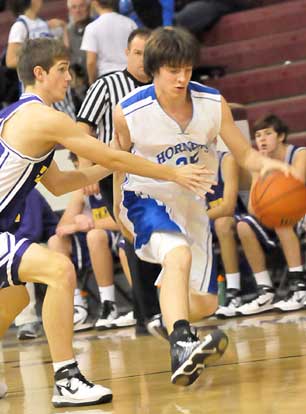 Chase Christie (25) starts a drive from the left wing. (Photo by Kevin Nagle)