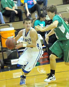 Bryant's Brantley Cozart, left, drives around Van Buren's Joseph Snapp. (Photo by Kevin Nagle)