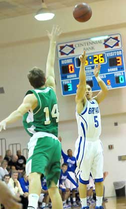 Jordan Griffin fires a 3 over Van Buren's Drew White. (Photo by Kevin Nagle)