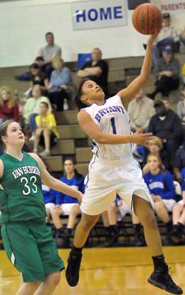 Kiara Moore goes up for a layin as Van Buren's Mallory Brown trails the play. (Photo by Kevin Nagle)