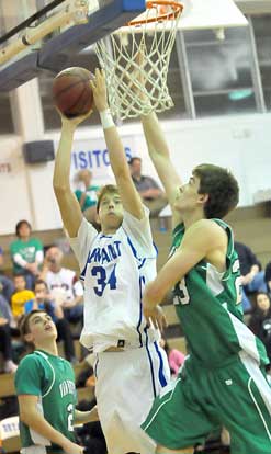 Bryant's Quinton Motto (34) goes at Van Buren's Hooper Vint (23). (photo by Kevin Nagle)