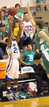 Marcus Wilson launches a 3. (Photo by Kevin Nagle)