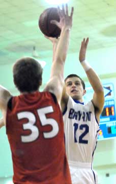 Brantley Cozart shoots over Cabot's Kai Davis. (Photo by Kevin Nagle)
