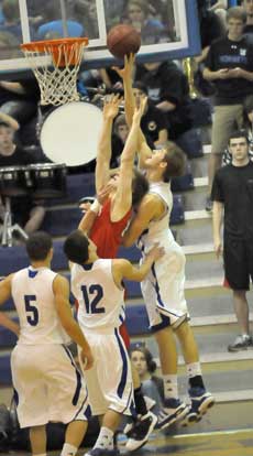 Quinton Motto goes high for a tip over a Cabot defender. (Photo by Kevin Nagle)