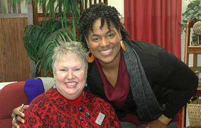 Bryant High School librarian Rebecca Downey gets a hug from author Celia Anderson. (Photo by Martin Couch)