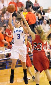 McKenzie Adams (3) goes up for a shot over Russellville's Jaimie Long (23). (Photo by Kevin Nagle)