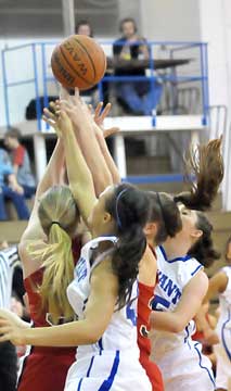 Bryant's Breanna Blundell (40) and Courtney Davidson, right, fight for a rebound. (Photo by Kevin Nagle)