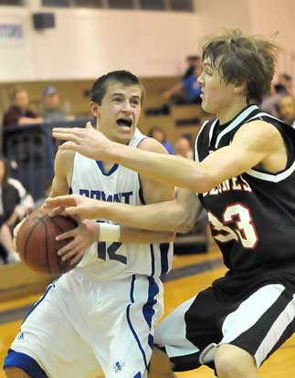 Bryant's Brantley Cozart tries to find room around Russellville's Eric Turner. (Photo by Kevin Nagle)