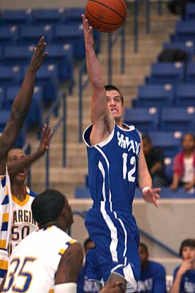 Brantley Cozart shoots over North Little Rock's Chris Campbell. (Photo by Rick Nation)