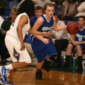 Logan Davis drives around North Little Rock's Anikae Brown. (Photo by Rick Nation)