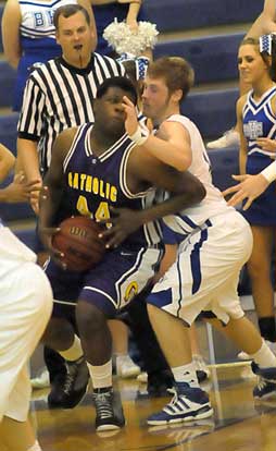 Bryant's Kyle Nossaman defends against Little Rock Catholic's Devan James. (Photo by Kevin Nagle)