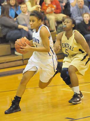 Bryant's Kiara Moore, left, drives past Central's Brittney Leonard. (Photo by Kevin Nagle)