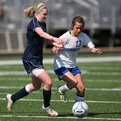 Bryant's Bailey Gartrell (13) contends for possession. (Photo by Rick Nation)