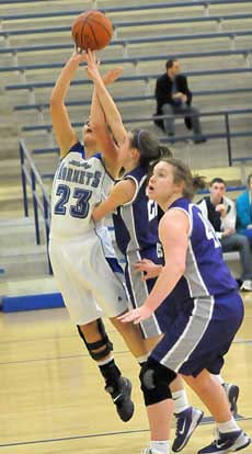 Bryant's Aubree Allen (23) gets fouled as she goes up for a shot. (Photo by Kevin Nagle)