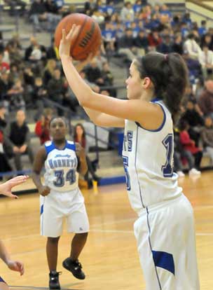 Rori Whittaker fires a shot after taking a pass from teammate Destin Nichols. (Photo by Kevin Nagle)