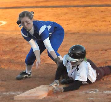 Kayla Sory, left, makes a tag at first. (Photo by Kevin Nagle)