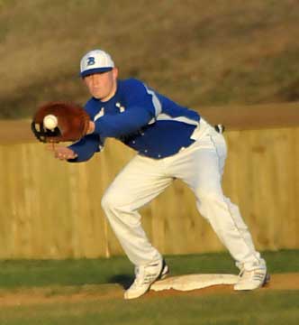 Tyler Brown takes a throw at first. (Photo by Kevin Nagle)