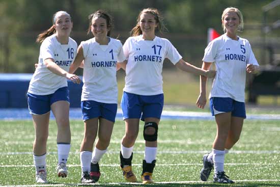 From a game earlier this season, Erica Selig (16), Lexie Balisterri (1), Tarra Hendricks (17) and Katie Moore (5). (Photo by Rick Nation)