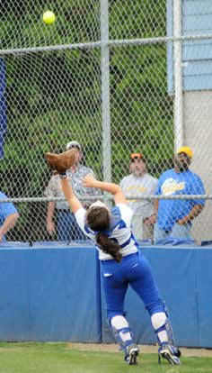 Bryant catch Jessie Taylor backpedals to grab a foul pop. (Photo by Kevin Nagle)