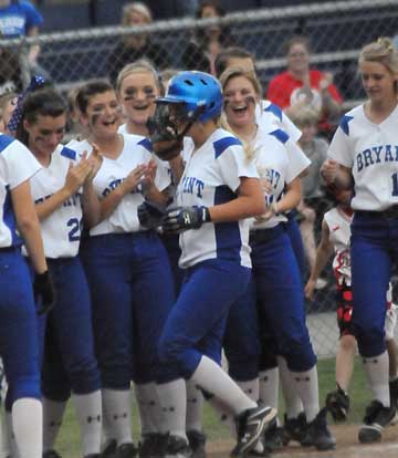 Cassidy Wilson is greeted by her teammates at homeplate after her second-inning homer. (Photo by Kevin Nagle)