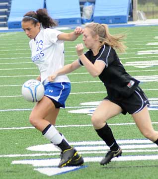 Bryant's McKenzie Adams, left, protects the ball from the attack of a Central player. (Photo by Kevin Nagle)